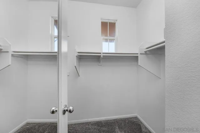 a view of an empty walk in closet