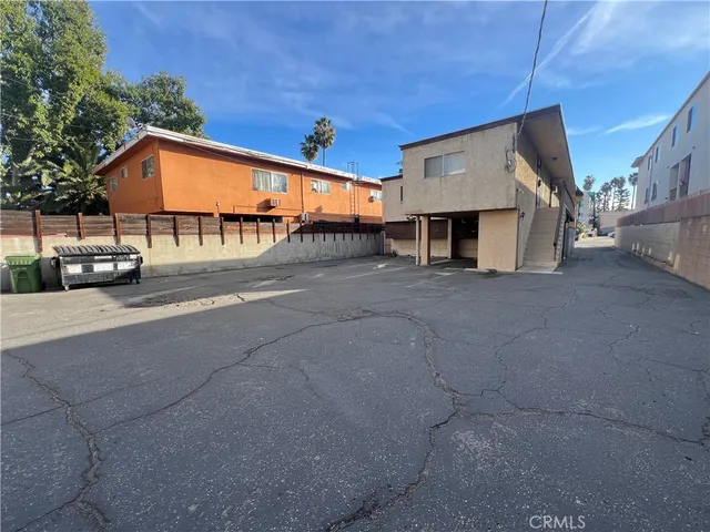 a view of a car park in front of house