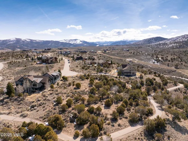 an aerial view of residential house and green space