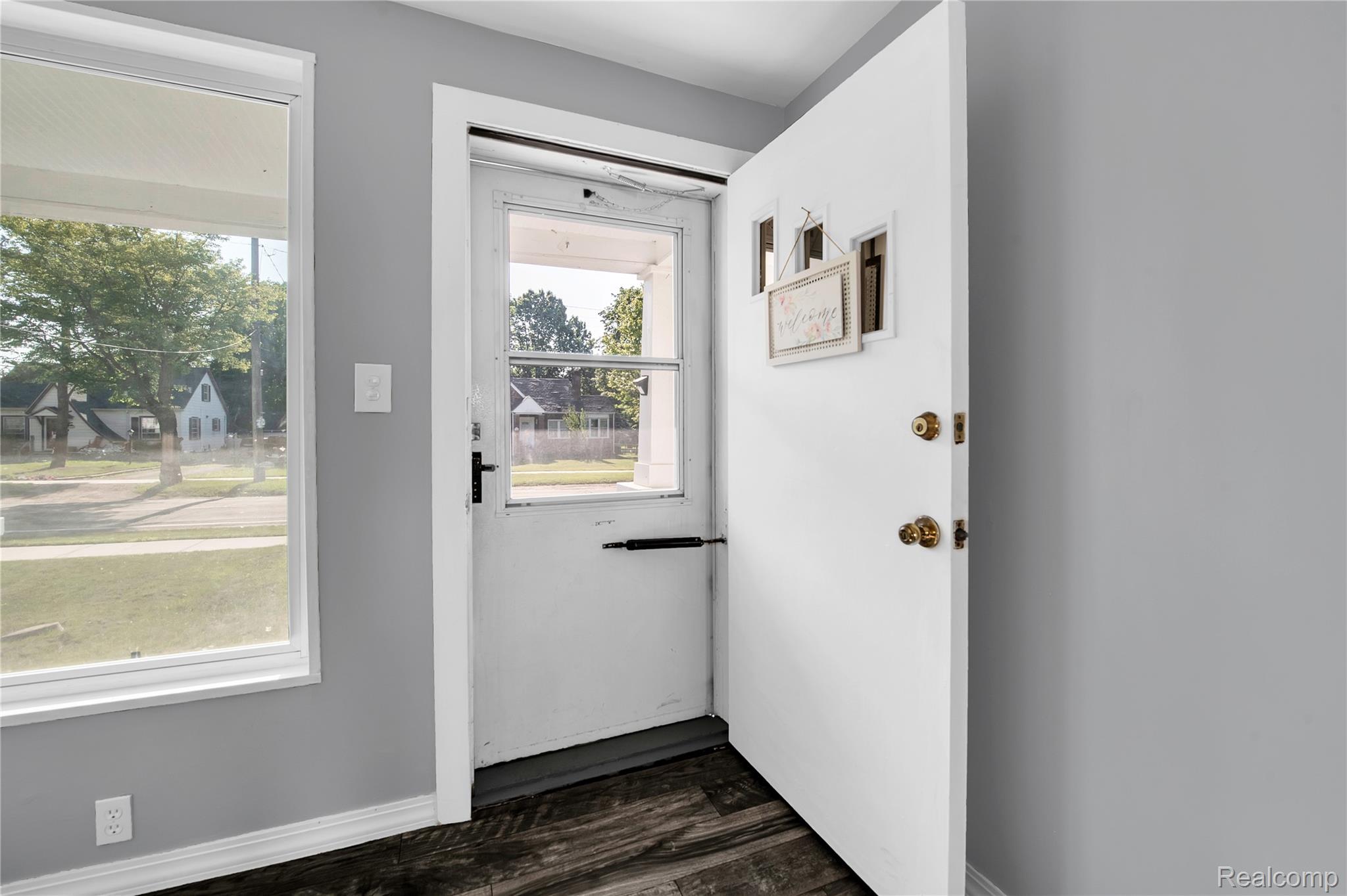 58925 Haven Ridge Road New Haven, MI 48048 - Photo 6 of 22 Entryway featuring wood finished floors and baseboards