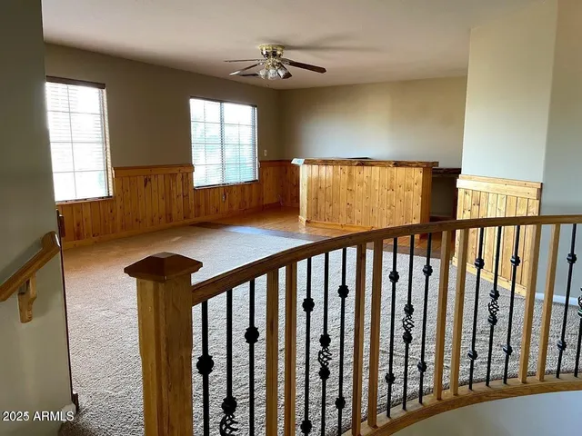 a view of entryway with a window and wooden floor