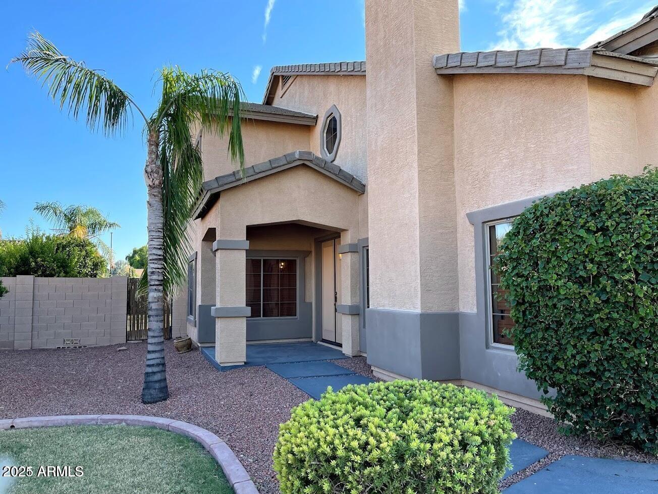 3235 East Devonshire Court Gilbert, AZ 85297 - Photo 5 of 28 a front view of a house with garden
