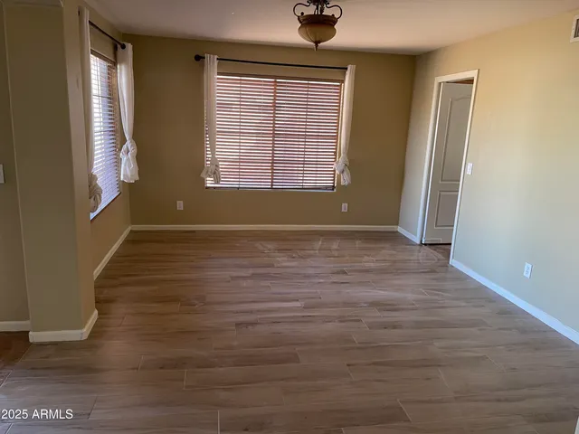 a view of an empty room with windows