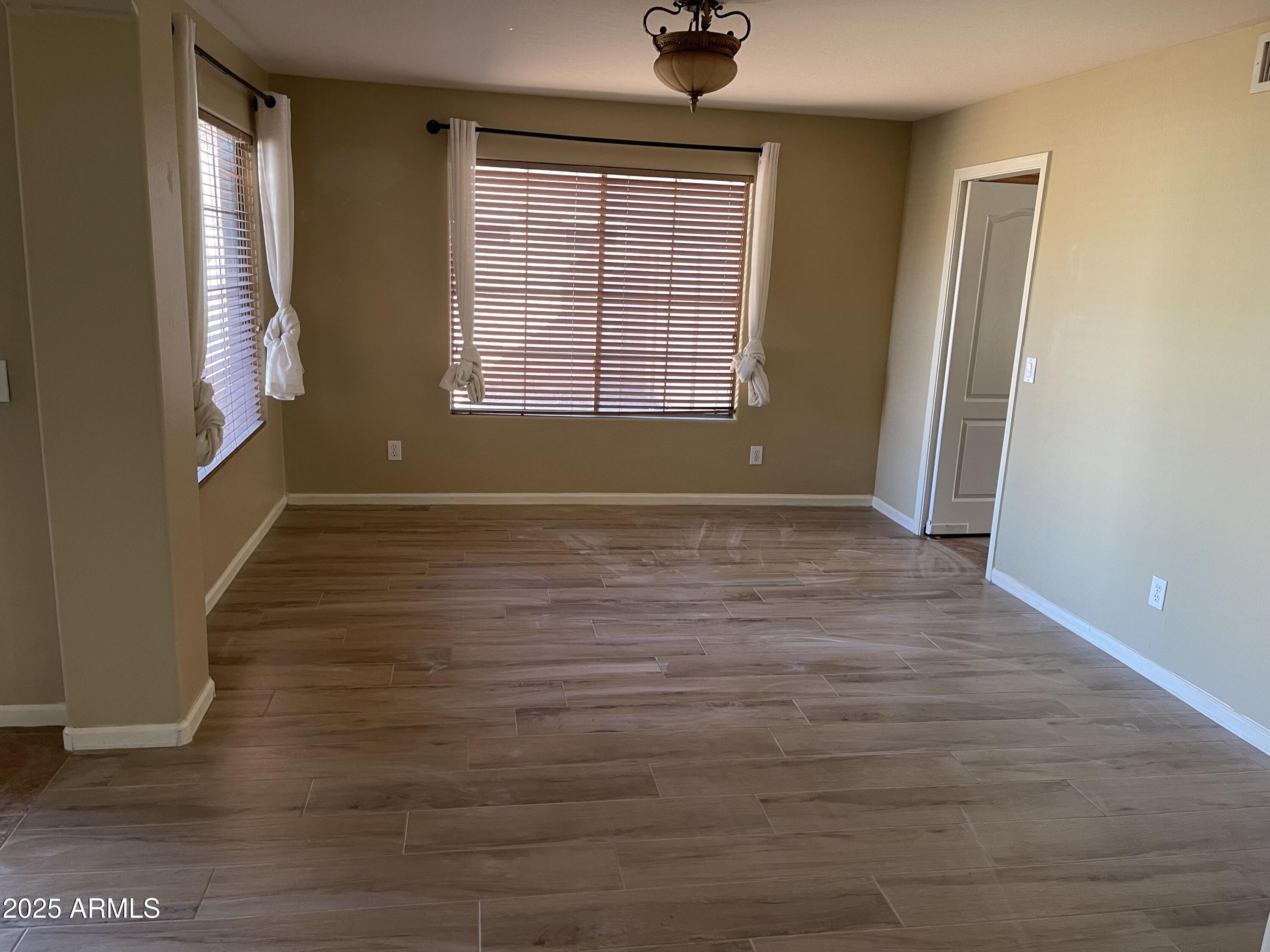 3235 East Devonshire Court Gilbert, AZ 85297 - Photo 9 of 28 a view of an empty room with windows