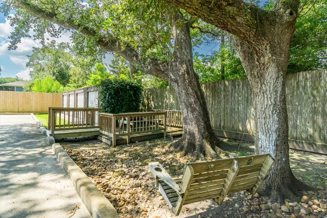 a view of a bench in a backyard