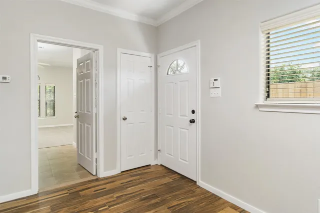 wooden floor with white walls