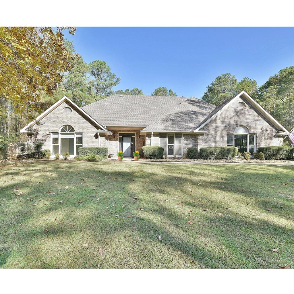 8935 K Moore Road Columbus, GA 31904 - Photo 1 of 36 a front view of a house with a yard