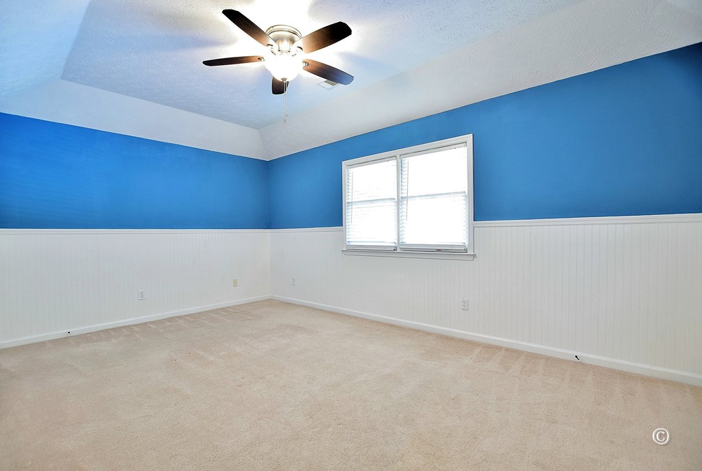 8935 K Moore Road Columbus, GA 31904 - Photo 15 of 36 an empty room with a window and a ceiling fan