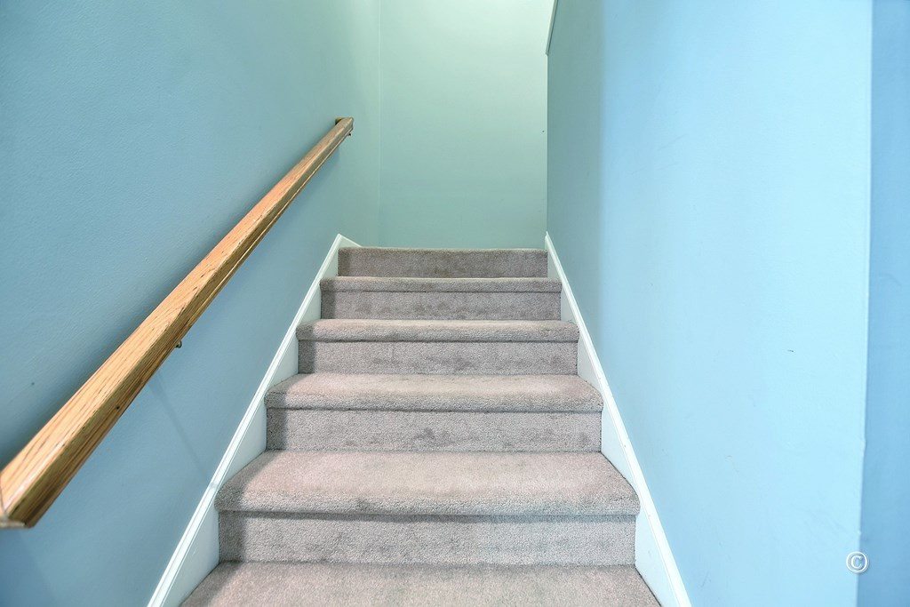 8935 K Moore Road Columbus, GA 31904 - Photo 23 of 36 a view of staircase with white walls