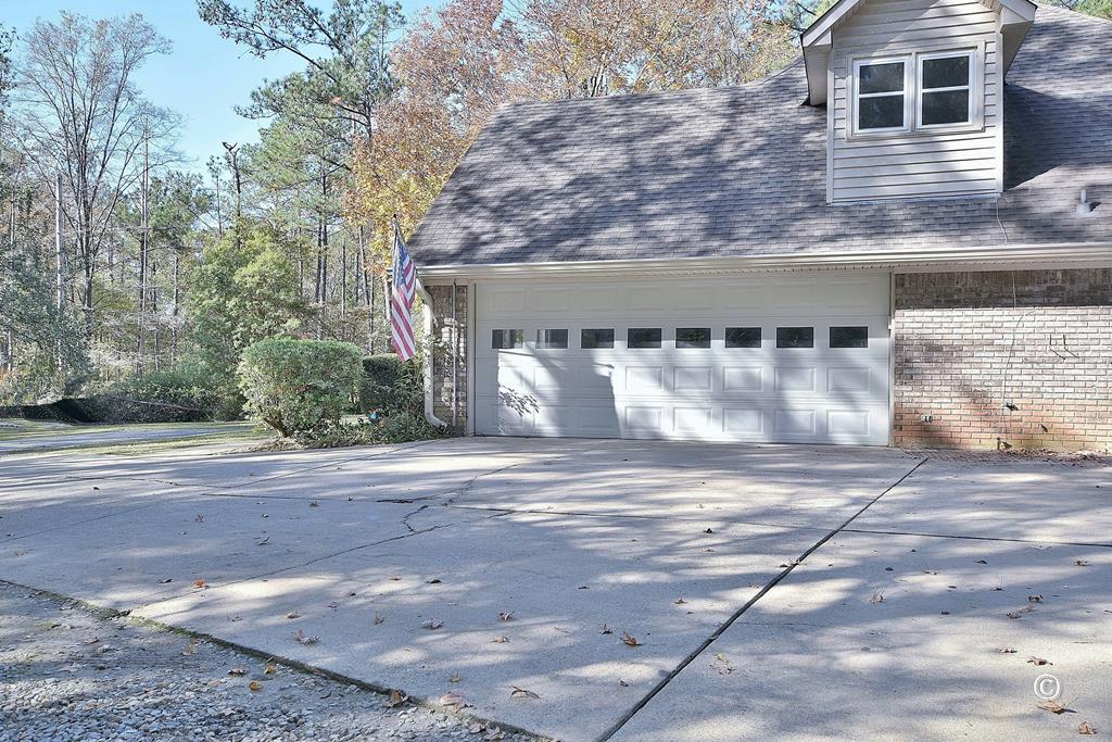 8935 K Moore Road Columbus, GA 31904 - Photo 34 of 36 a view of a house with a yard