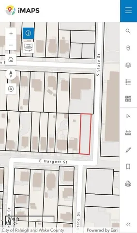 a view of a white building with glass windows