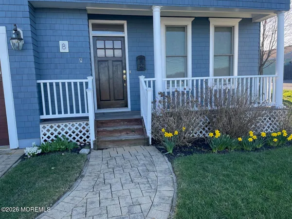 a view of a house with wooden fence