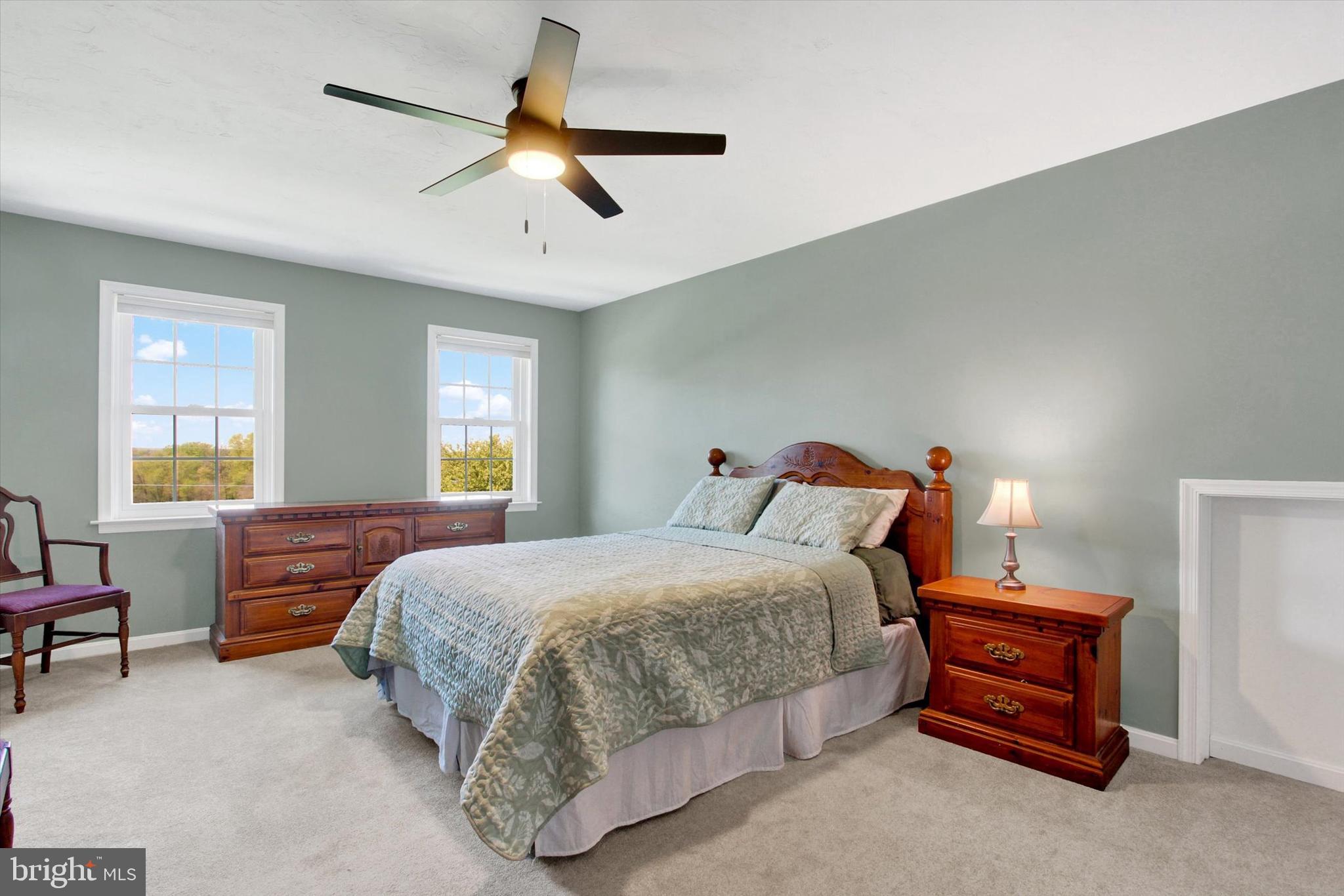 2474 Meeting House Road Spring Grove, PA 17362 - Photo 21 of 51 a bedroom with a bed and a chandelier
