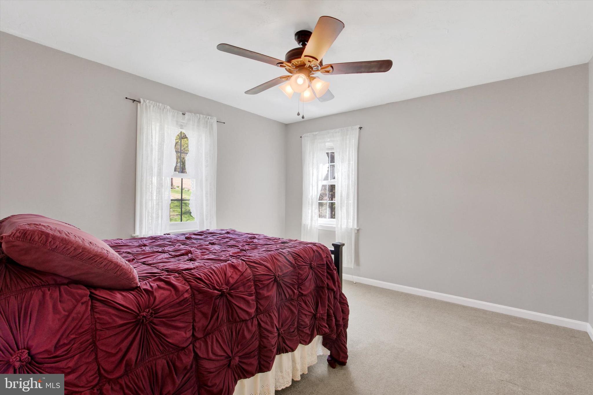2474 Meeting House Road Spring Grove, PA 17362 - Photo 25 of 51 a bedroom with a bed and a ceiling fan