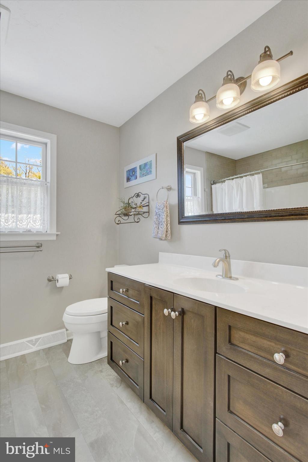 2474 Meeting House Road Spring Grove, PA 17362 - Photo 29 of 51 a bathroom with a toilet a sink and mirror