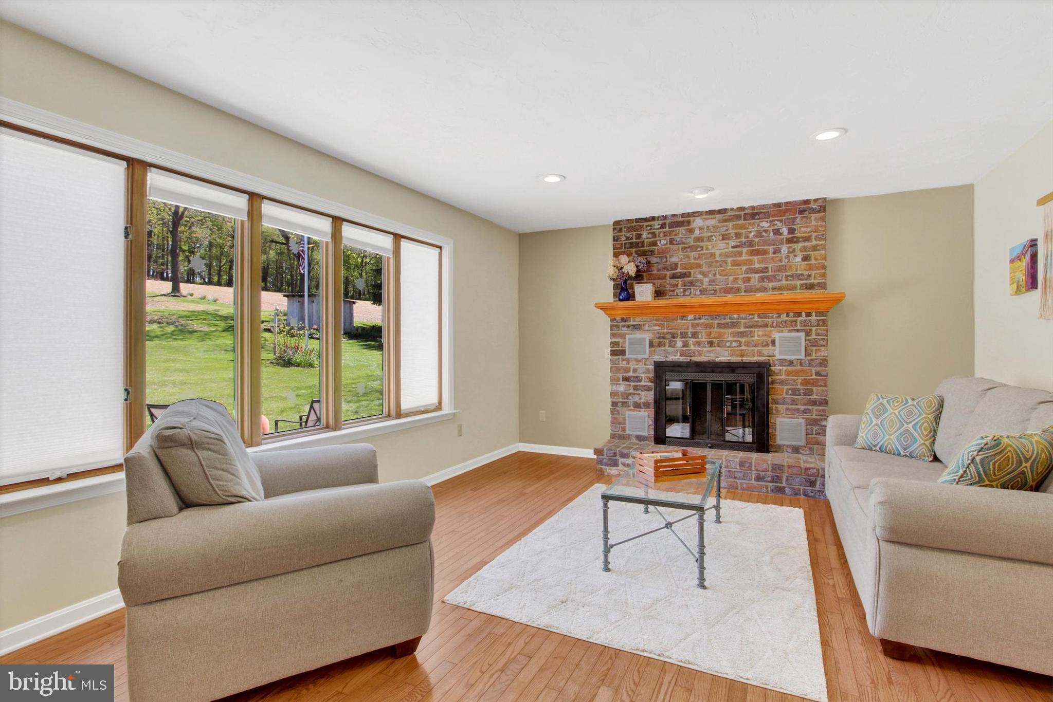 2474 Meeting House Road Spring Grove, PA 17362 - Photo 9 of 51 a living room with furniture and a fireplace
