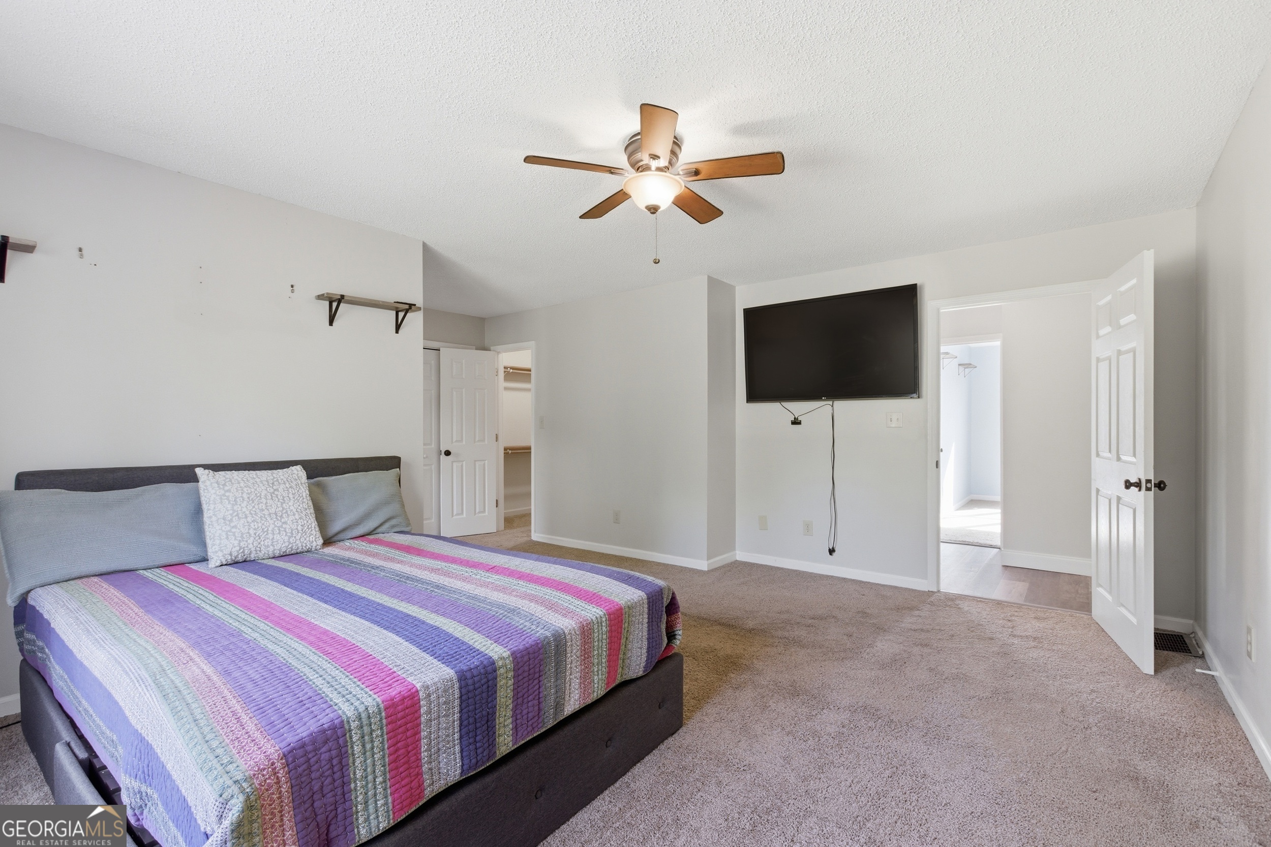 260 Brookhaven Circle Toccoa, GA 30577 - Photo 11 of 26 a bedroom with a bed and a flat screen tv