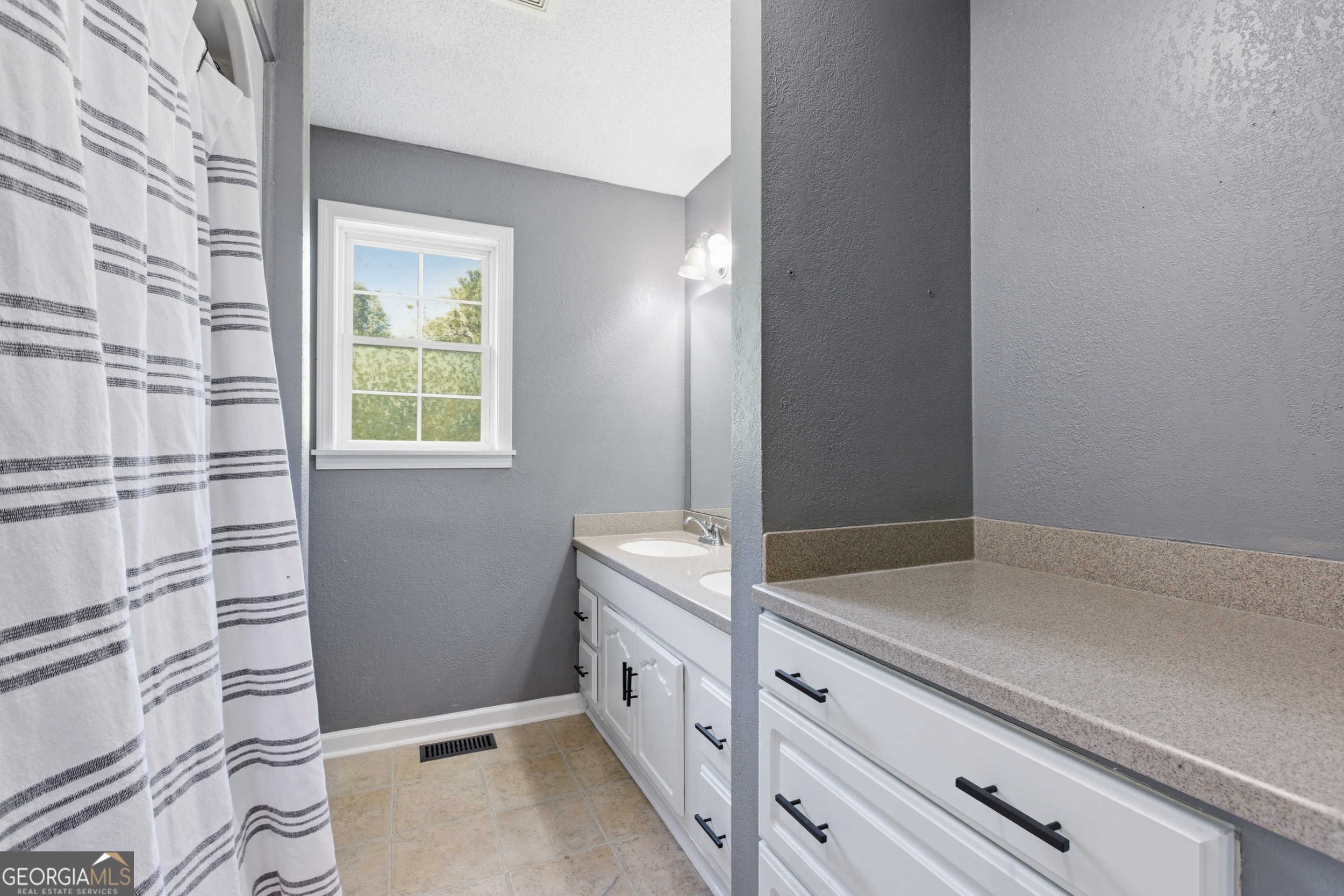 260 Brookhaven Circle Toccoa, GA 30577 - Photo 13 of 26 a bathroom with a sink and a mirror