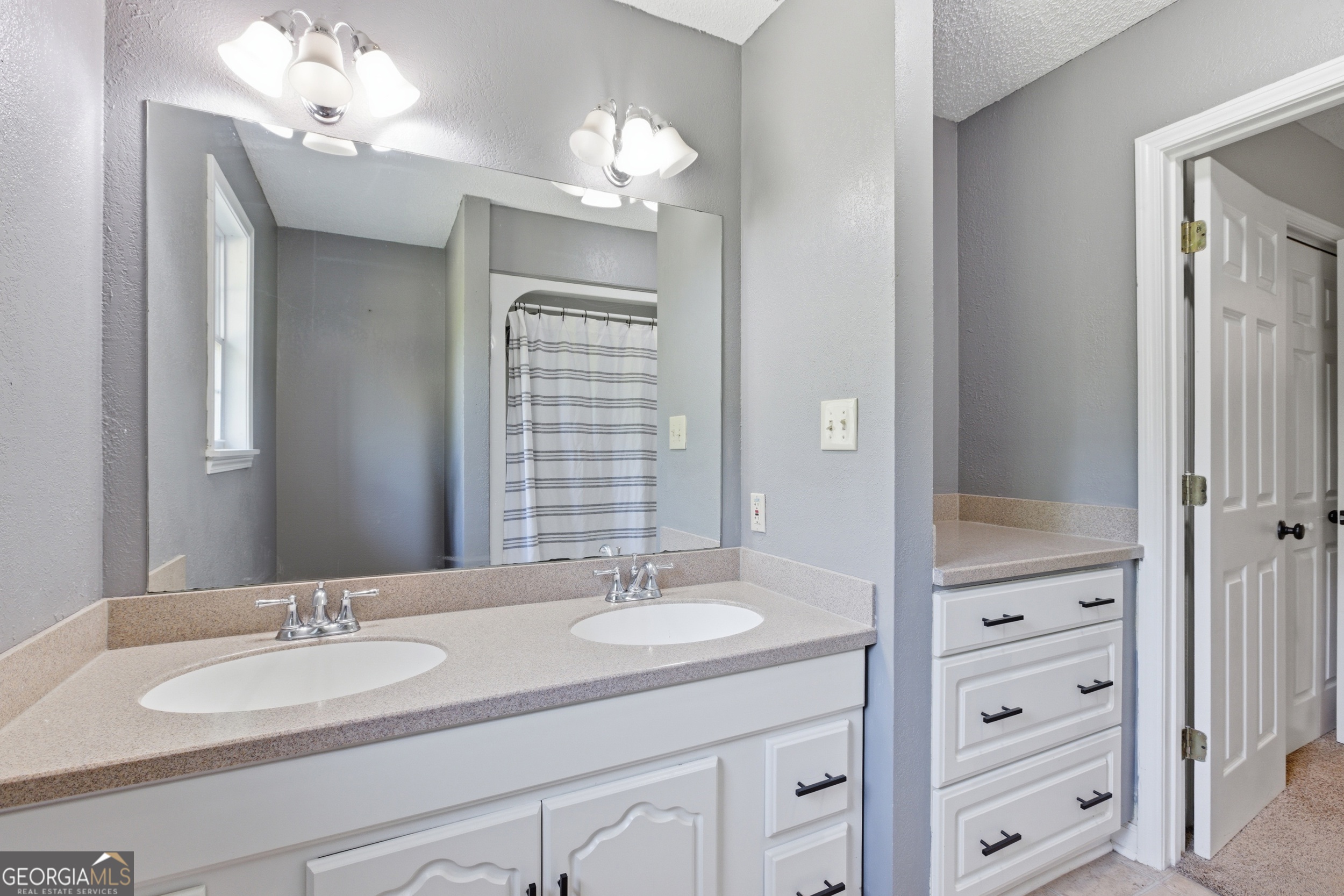 260 Brookhaven Circle Toccoa, GA 30577 - Photo 14 of 26 a bathroom with a granite countertop sink and a mirror