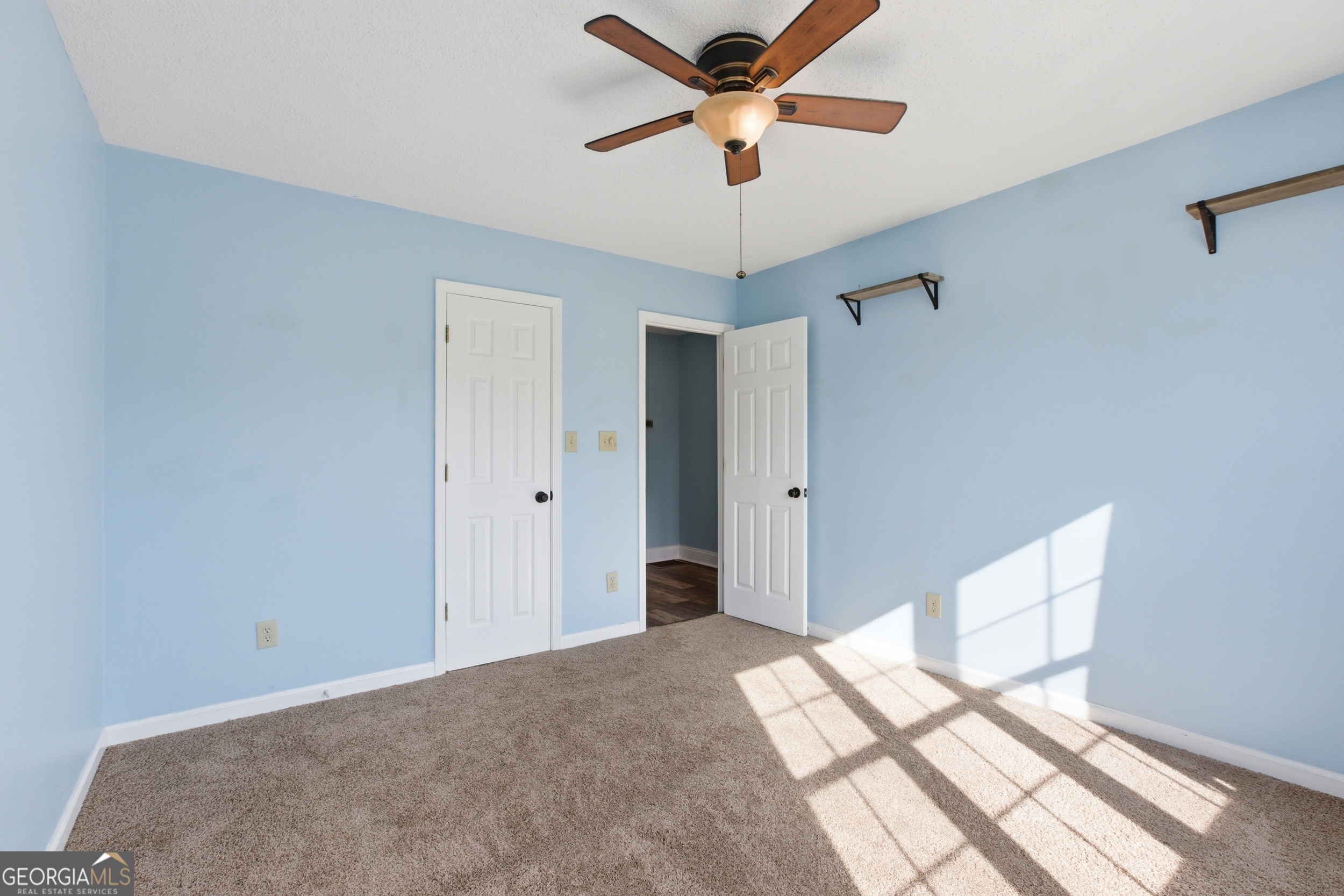 260 Brookhaven Circle Toccoa, GA 30577 - Photo 16 of 26 a bedroom with a bed and a chandelier fan