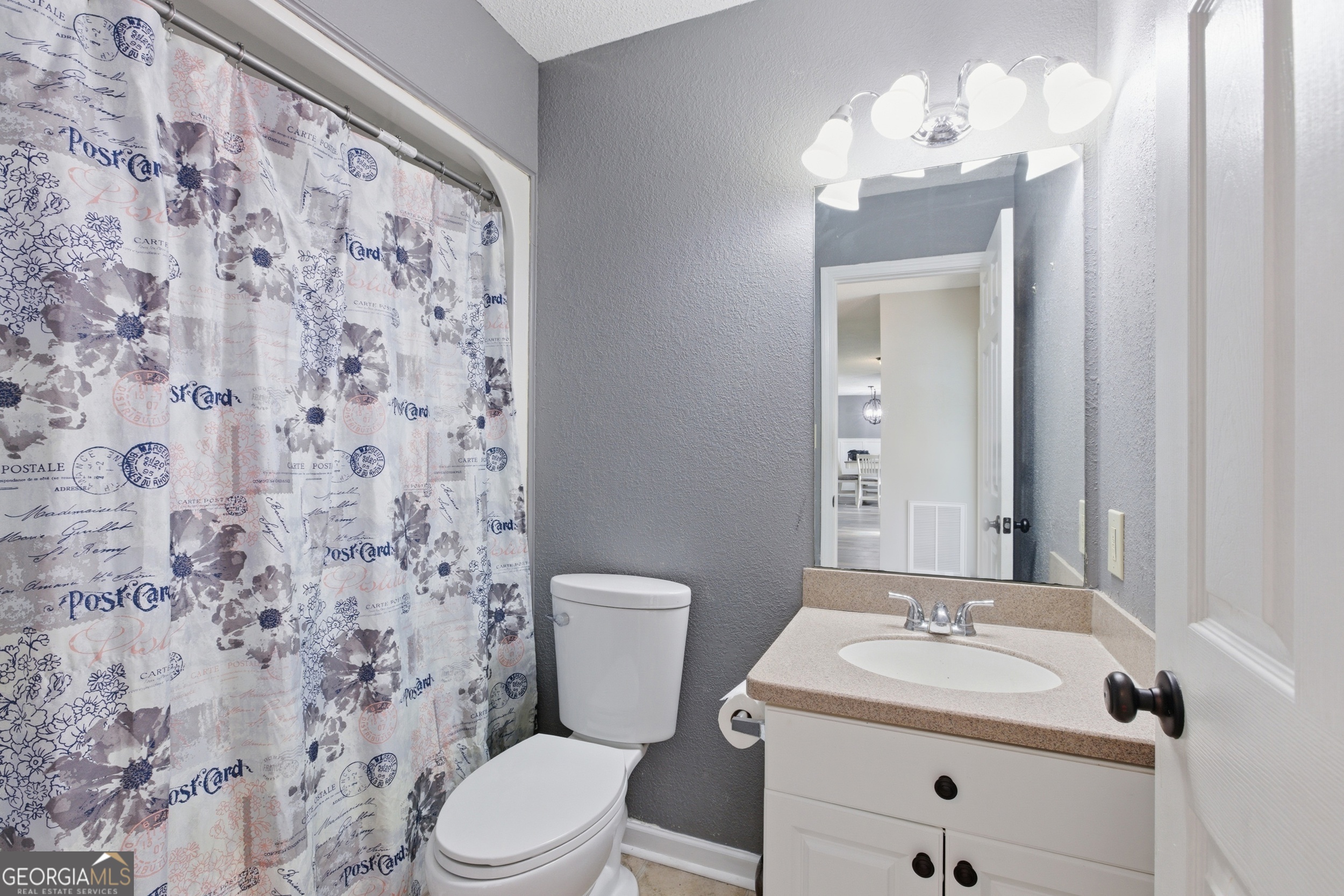 260 Brookhaven Circle Toccoa, GA 30577 - Photo 19 of 26 a bathroom with a sink vanity mirror and toilet