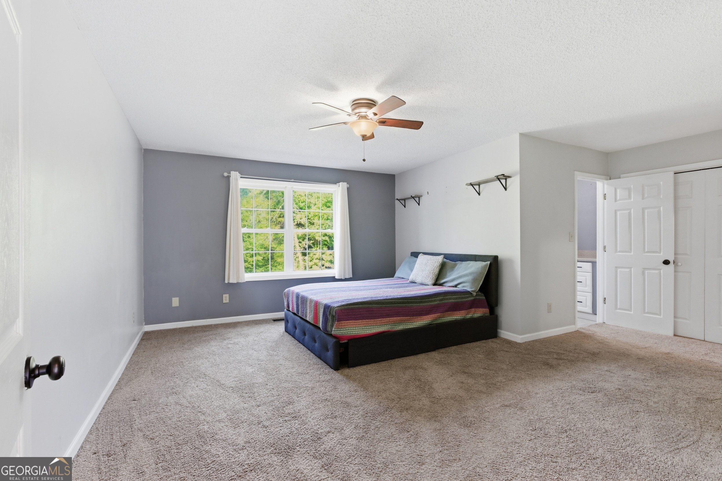 260 Brookhaven Circle Toccoa, GA 30577 - Photo 10 of 26 a spacious bedroom with a bed and a window