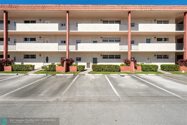 a view of a street with a building in the background