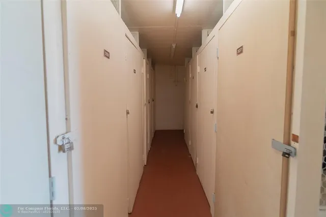 a view of a hallway with a wooden floor
