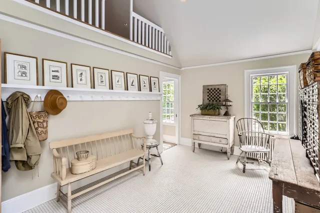 a view of a livingroom with furniture and a fireplace