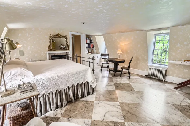 a view of a house with a yard and sitting area