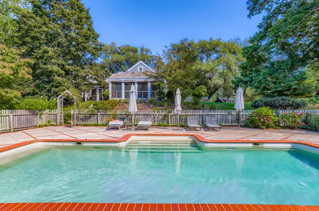 a living room with furniture rug and a large window