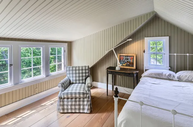 a view of a chairs and table in backyard of the house