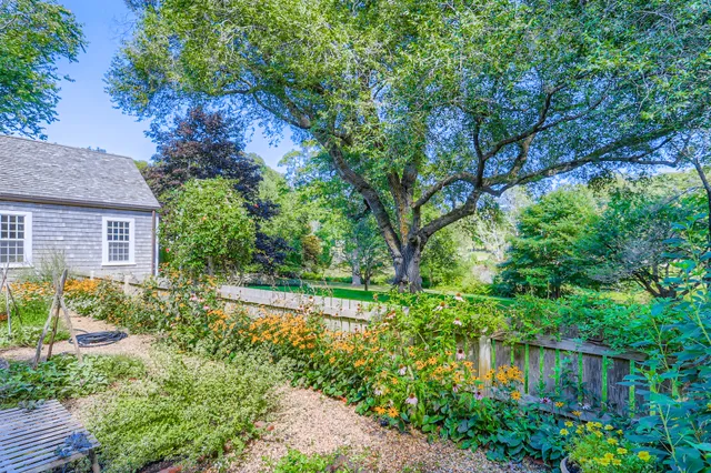 a living room with furniture fireplace and a window