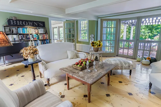 a view of a patio with table and chairs and potted plants