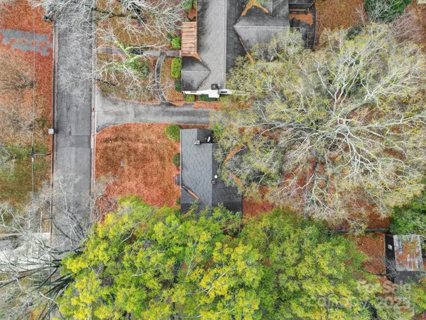 a aerial view of a house with a yard and garden