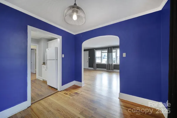 a view of livingroom with hardwood floor and hallway