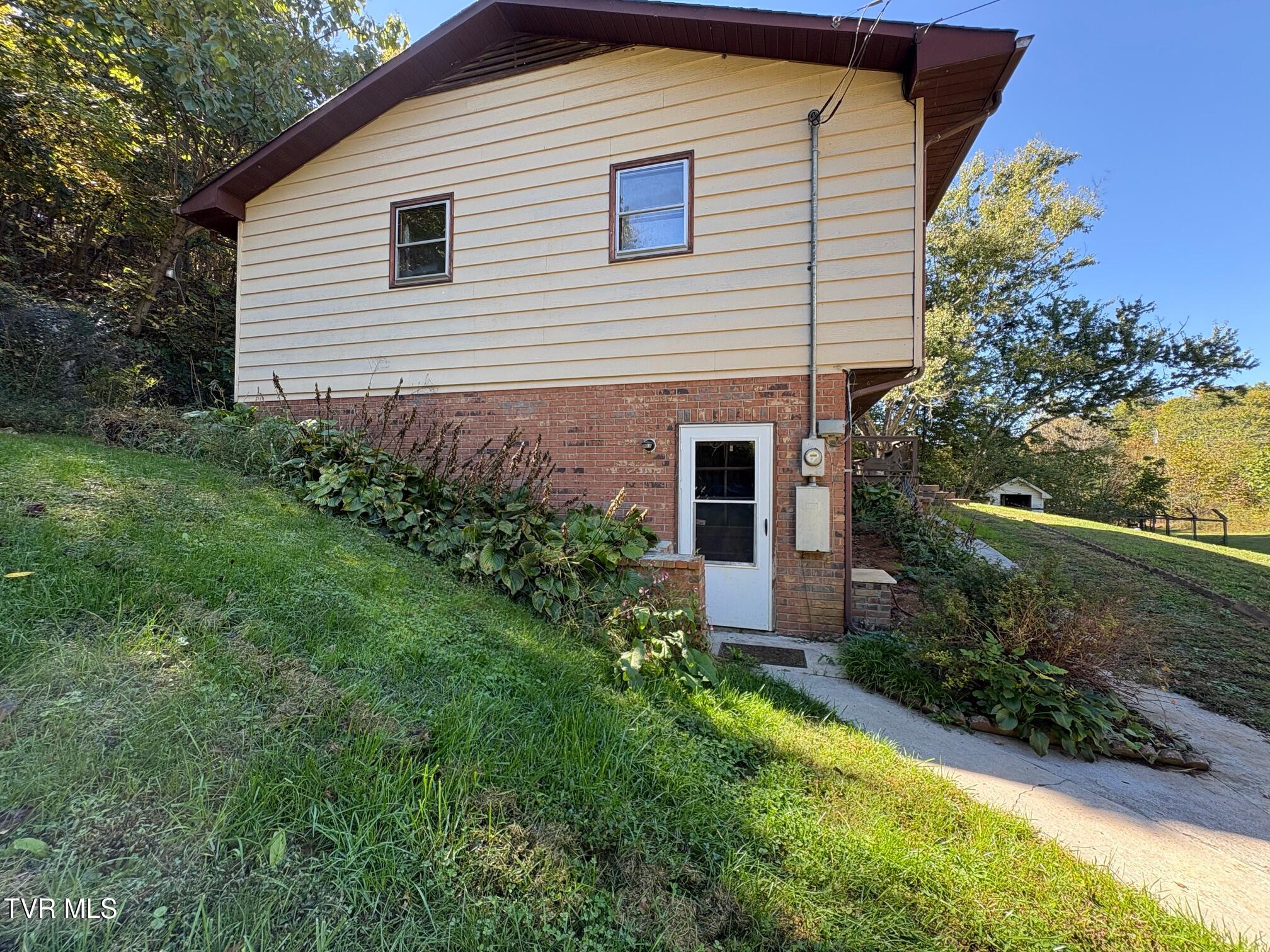 345 Mt Wesley Road Telford, TN 37690 - Photo 5 of 42 Basement Exterior Entry