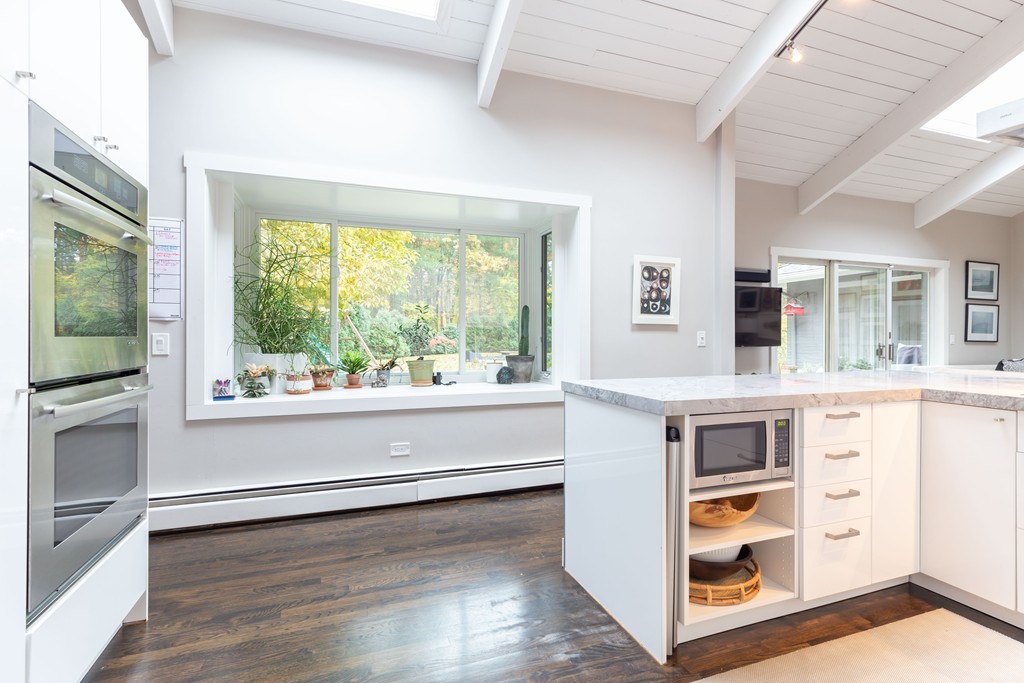140 Whiting Street Hingham, MA 02043 - Photo 11 of 25 a living room with stainless steel appliances wooden floor and a large window