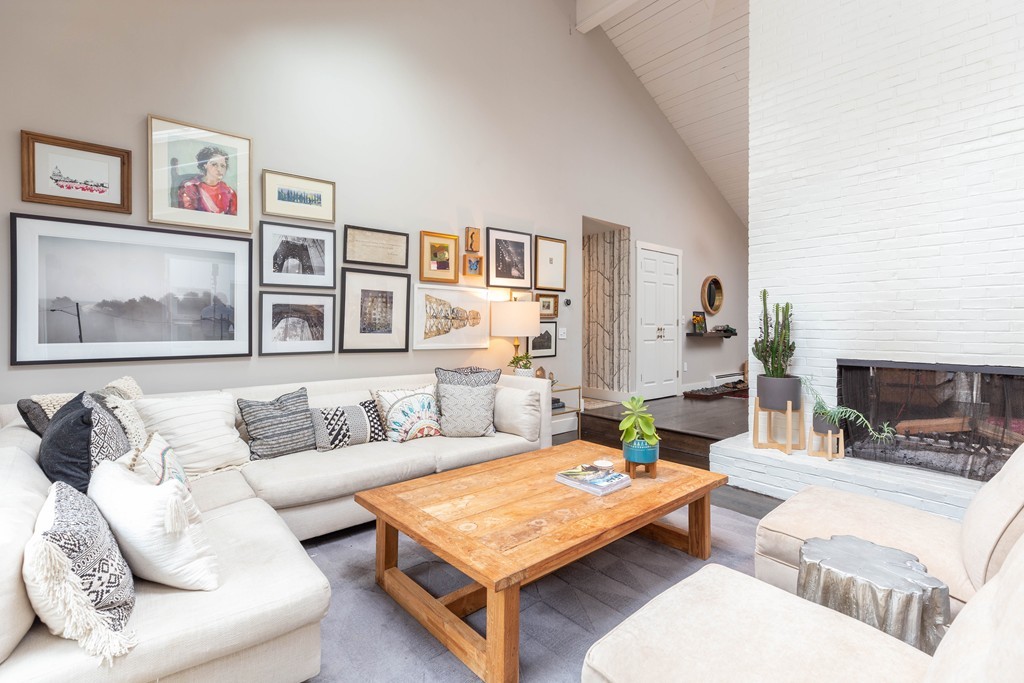 140 Whiting Street Hingham, MA 02043 - Photo 6 of 25 a living room with furniture and a fireplace