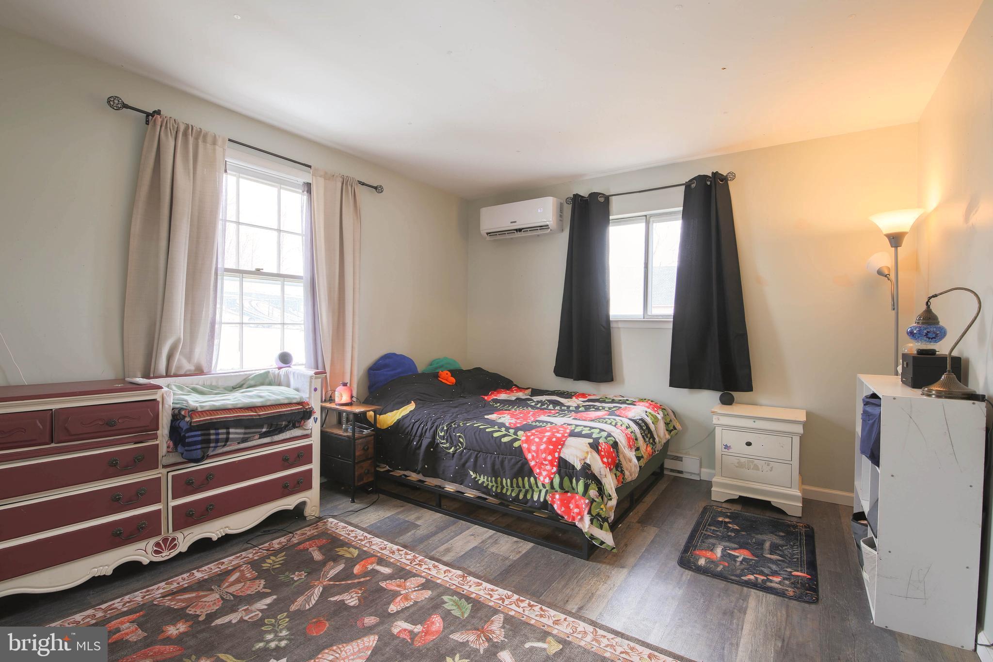 105 West Village Road Elkton, MD 21921 - Photo 12 of 32 a bedroom with a bed and a window