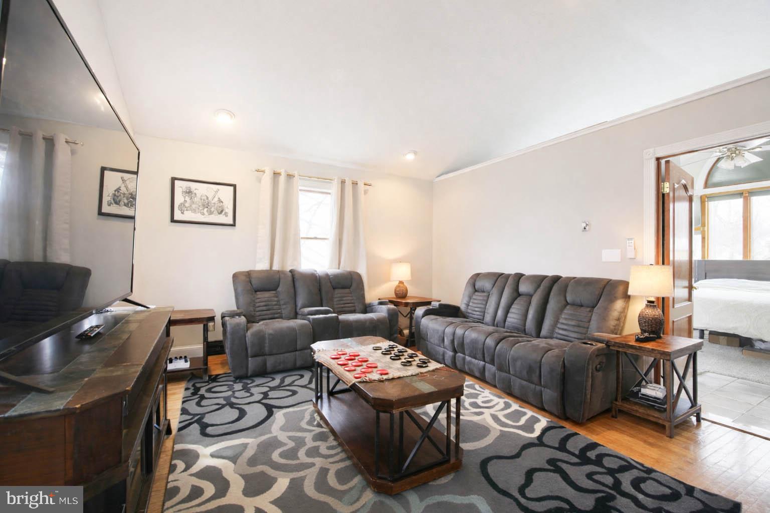 105 West Village Road Elkton, MD 21921 - Photo 14 of 32 a living room with furniture a rug and a window