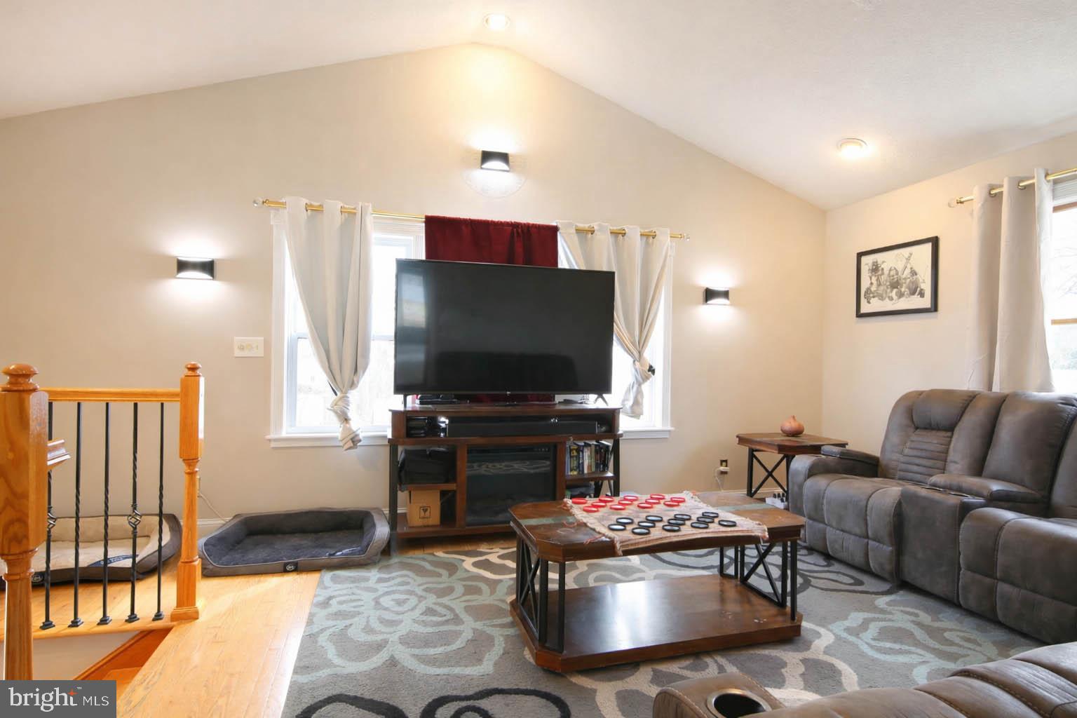105 West Village Road Elkton, MD 21921 - Photo 15 of 32 a living room with furniture and a flat screen tv