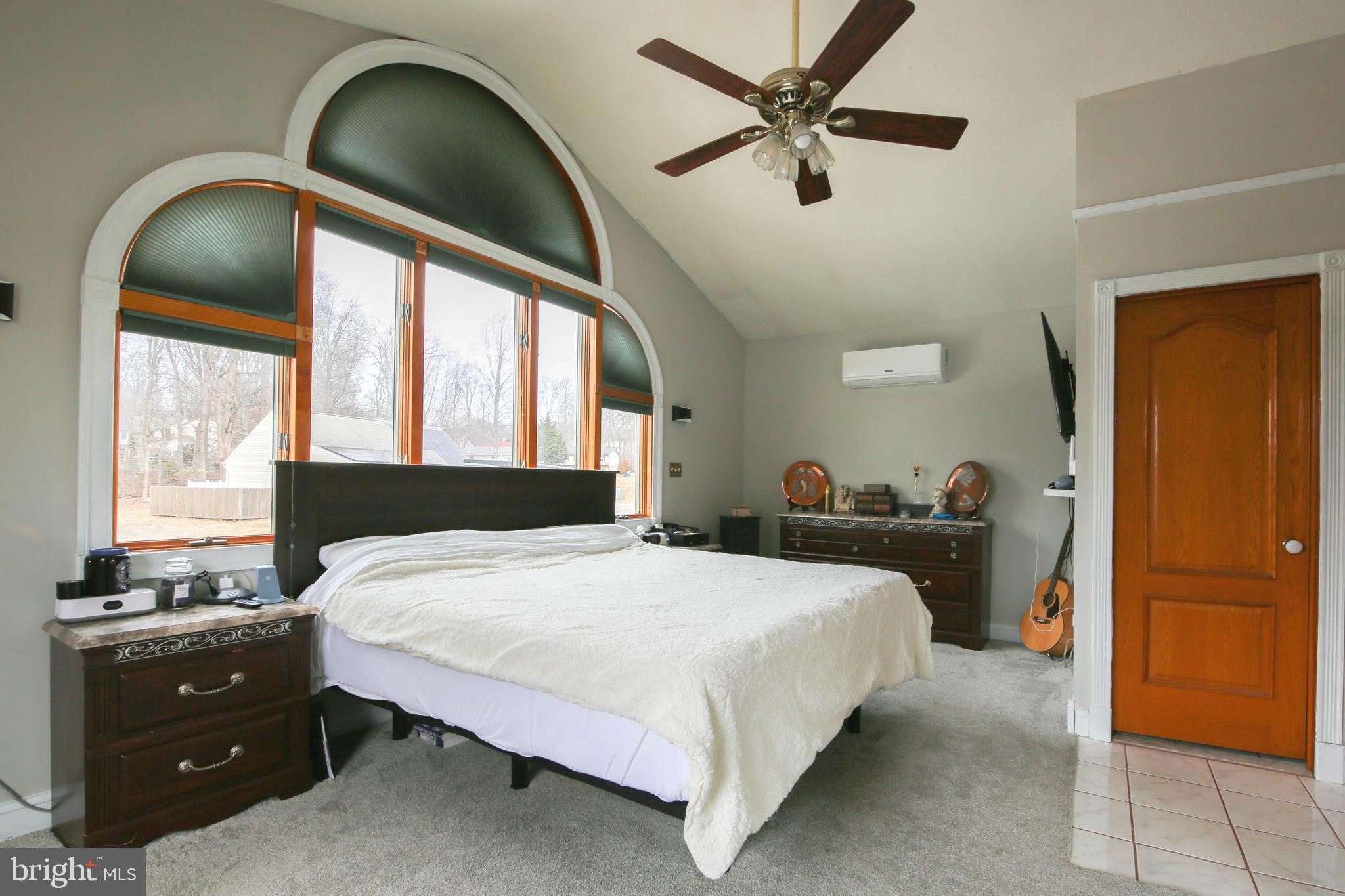 105 West Village Road Elkton, MD 21921 - Photo 20 of 32 a bedroom with a bed and a dresser