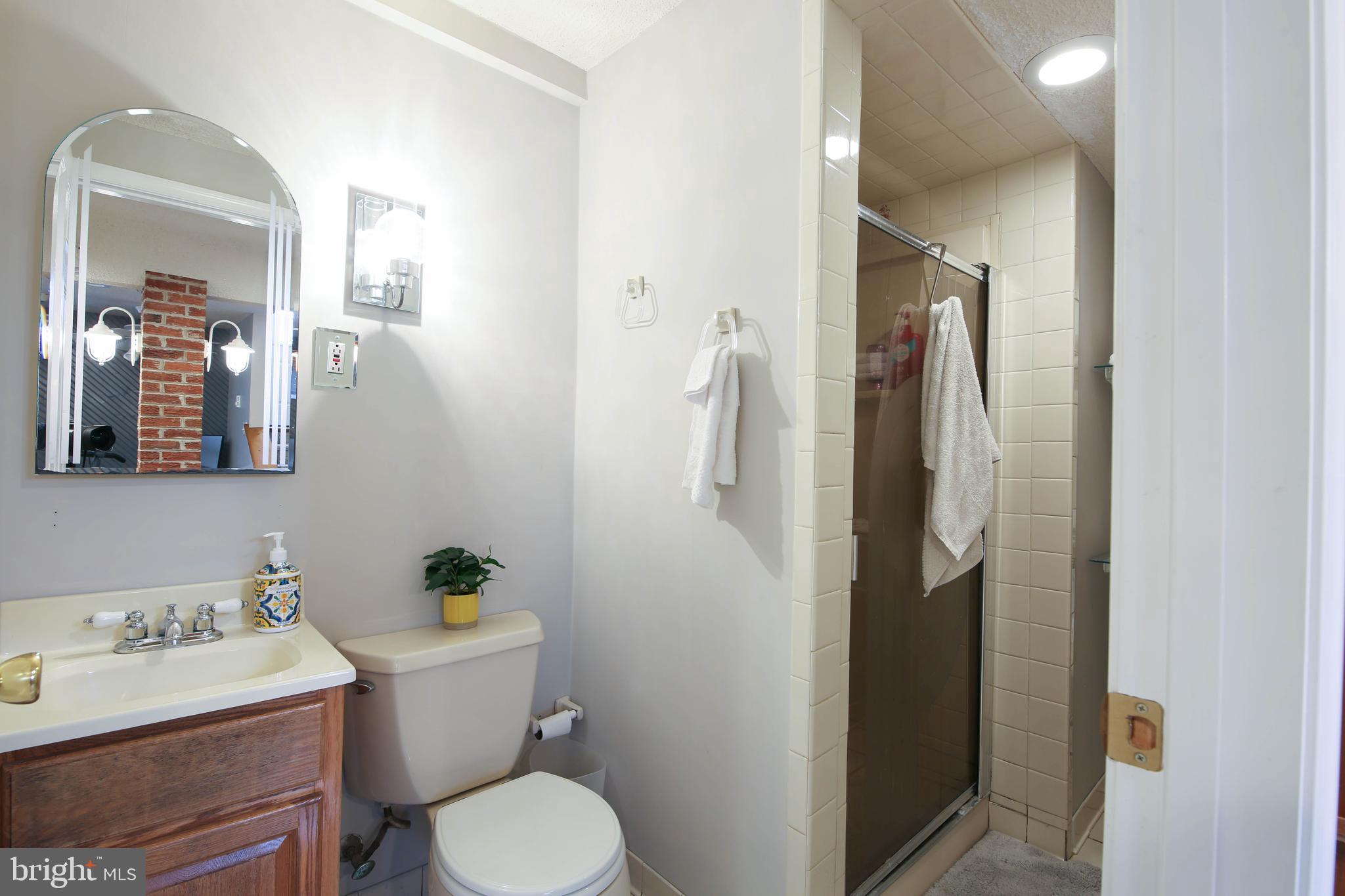 105 West Village Road Elkton, MD 21921 - Photo 25 of 32 a bathroom with a sink toilet and shower