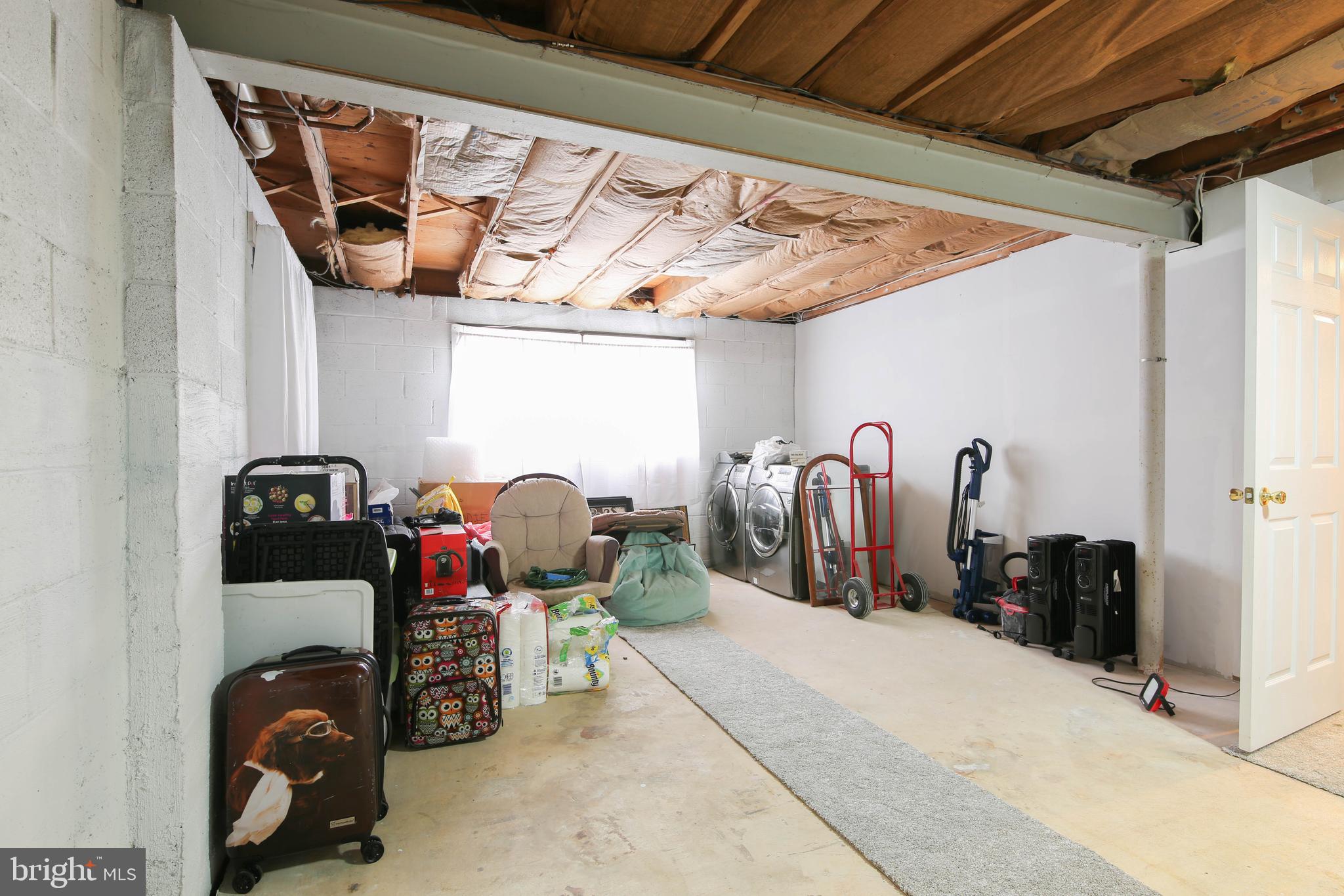 105 West Village Road Elkton, MD 21921 - Photo 27 of 32 a view of walk in closet with clothes and shoes