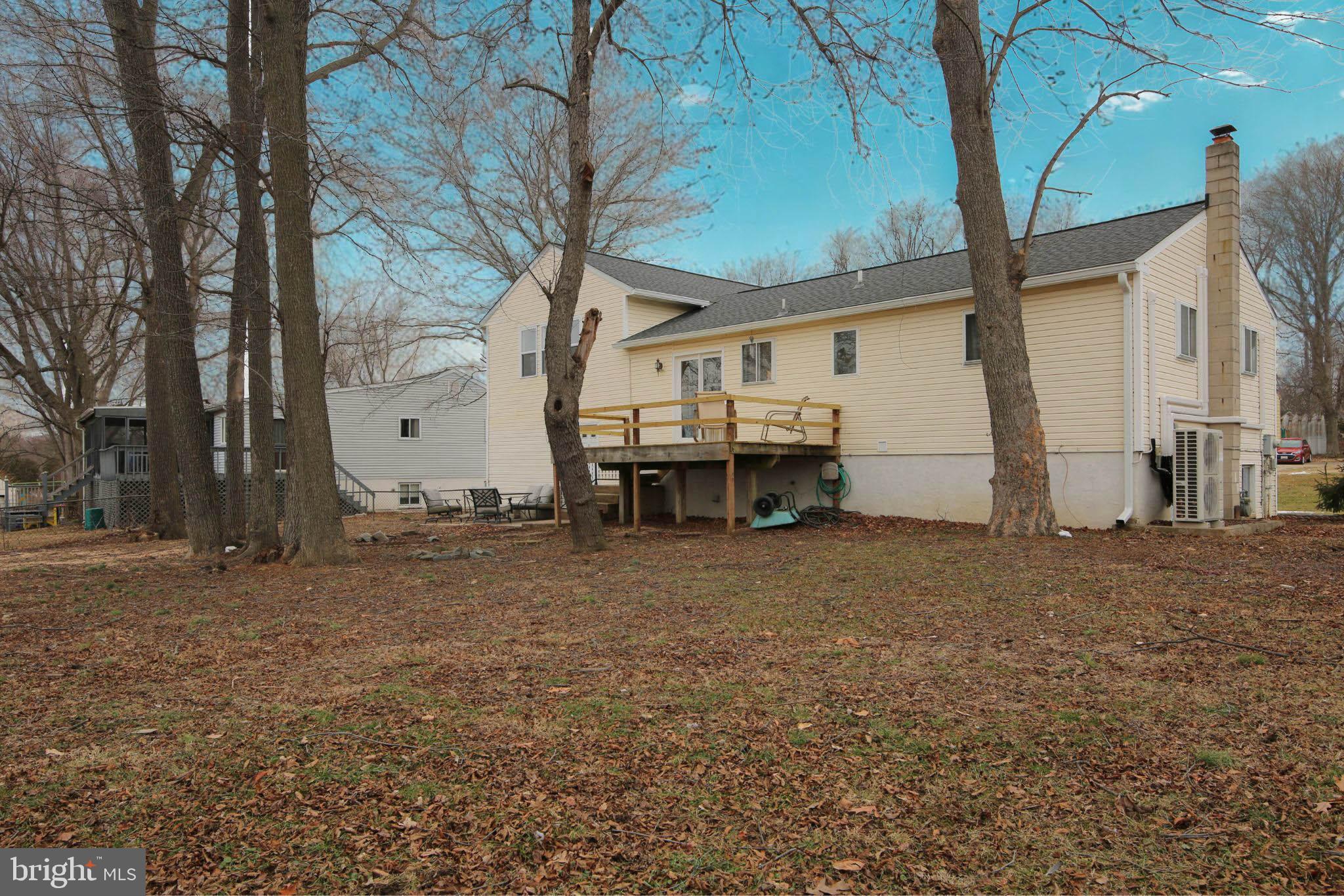 105 West Village Road Elkton, MD 21921 - Photo 29 of 32 a view of a house with backyard and trees