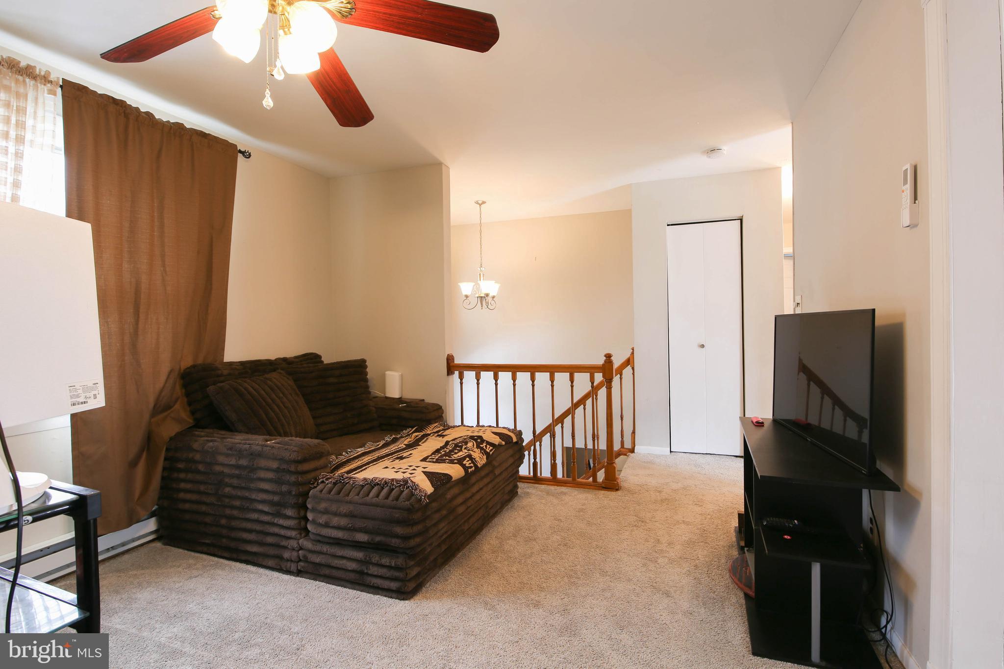 105 West Village Road Elkton, MD 21921 - Photo 4 of 32 a living room with furniture and a flat screen tv