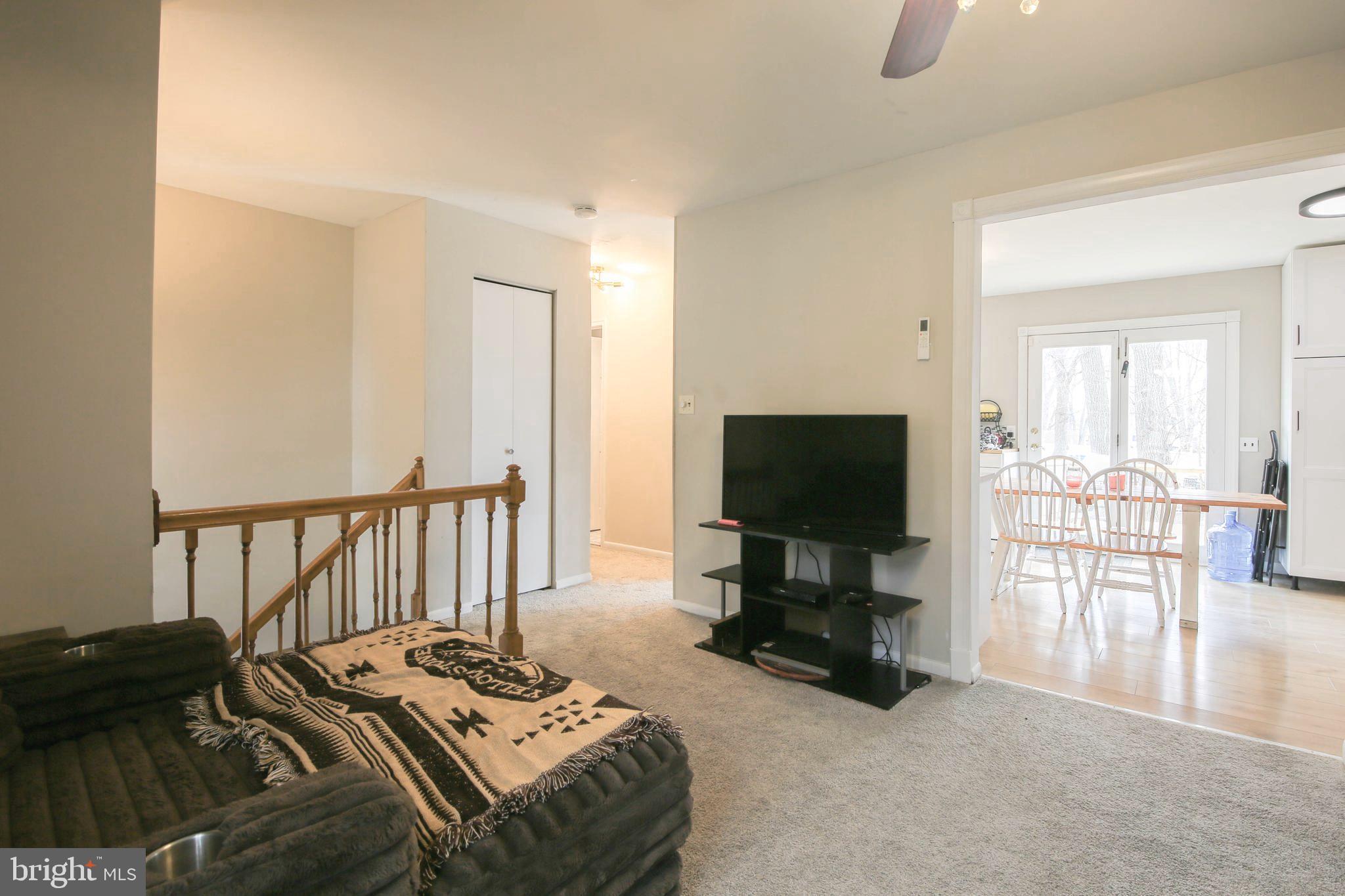 105 West Village Road Elkton, MD 21921 - Photo 5 of 32 a bedroom with furniture and a flat screen tv