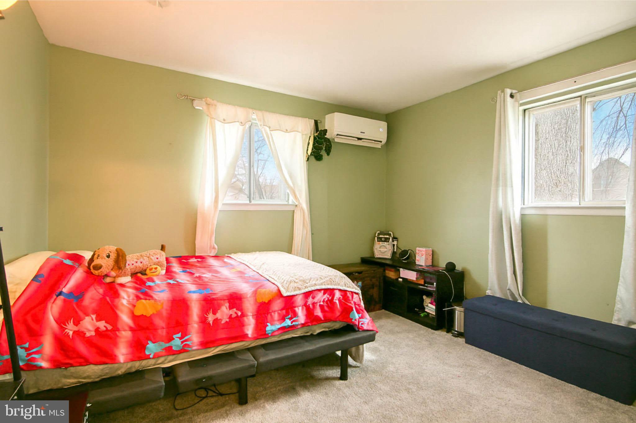 105 West Village Road Elkton, MD 21921 - Photo 10 of 32 a bedroom with a bed and window