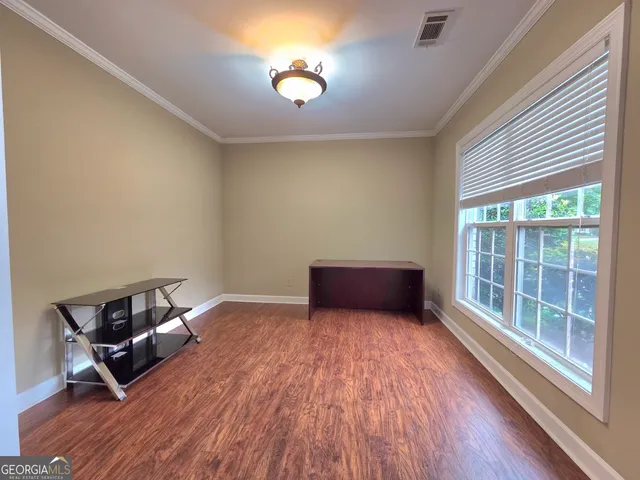 a room with a bed and a window